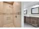 Bathroom shower featuring decorative tile surround, fixtures, and built-in niche at 1388 Aragon Beach Rd, Rock Hill, SC 29732