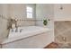 Spa-like bathroom features a tub with tile surround and decorative accents at 1388 Aragon Beach Rd, Rock Hill, SC 29732