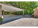 Spacious carport featuring stone pillars and outdoor living space at 1388 Aragon Beach Rd, Rock Hill, SC 29732