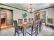 Spacious dining room featuring a large wooden table, decorative chairs, and views into other living spaces at 1388 Aragon Beach Rd, Rock Hill, SC 29732
