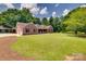 Beautiful brick home with well-manicured lawn and mature trees in a desirable location at 1388 Aragon Beach Rd, Rock Hill, SC 29732