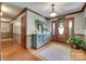 Elegant foyer with hardwood floors, a decorative mirror, and a wooden front door at 1388 Aragon Beach Rd, Rock Hill, SC 29732