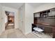 Hallway nook featuring built-in desk area with dark wood, connecting to other living spaces at 1388 Aragon Beach Rd, Rock Hill, SC 29732