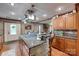 Spacious kitchen island featuring granite countertops, a gas cooktop, and decorative stone accents at 1388 Aragon Beach Rd, Rock Hill, SC 29732