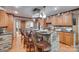 Stylish kitchen island with seating, granite countertops, and stainless steel appliances offer modern convenience at 1388 Aragon Beach Rd, Rock Hill, SC 29732