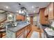 Open-concept kitchen with stainless appliances, hardwood floors, and granite countertops for modern elegance at 1388 Aragon Beach Rd, Rock Hill, SC 29732