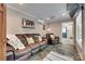 Comfortable living room with leather seating, neutral tones, and an open doorway creates a welcoming atmosphere at 1388 Aragon Beach Rd, Rock Hill, SC 29732