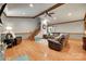 Cozy living room with hardwood floors, leather furniture, a staircase, and natural lighting at 1388 Aragon Beach Rd, Rock Hill, SC 29732
