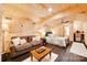 Living space with wooden walls, sofa, and bed with a kitchenette at 1388 Aragon Beach Rd, Rock Hill, SC 29732