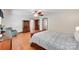 Main bedroom with hardwood floors, furniture, and doors to other rooms at 1388 Aragon Beach Rd, Rock Hill, SC 29732