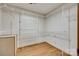 Walk-in closet features built-in shelving and hardwood floors at 1388 Aragon Beach Rd, Rock Hill, SC 29732