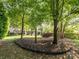 Secluded backyard with hammock, creating a tranquil space for outdoor enjoyment and relaxation at 13930 Daltrey Ln, Charlotte, NC 28277