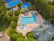 A shot of the community pool and playground featuring slides and splash pad for Gathering fun at 13930 Daltrey Ln, Charlotte, NC 28277