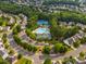 Aerial shot of the community pool, clubhouse, and tennis courts, providing recreational amenities at 13930 Daltrey Ln, Charlotte, NC 28277