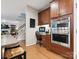 Gourmet kitchen with built-in stainless steel double ovens and a desk area at 13930 Daltrey Ln, Charlotte, NC 28277