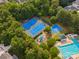 Overhead photograph of neighborhood tennis and basketball courts with play area and Gathering pool at 13930 Daltrey Ln, Charlotte, NC 28277