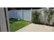 A cozy backyard featuring a white fence, green lawn and a concrete patio perfect for outdoor relaxation at 162 Autumn Falls Dr, Lake Wylie, SC 29710