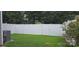 Spacious fenced backyard with a well-maintained lawn and mature trees for privacy and outdoor enjoyment at 162 Autumn Falls Dr, Lake Wylie, SC 29710