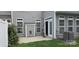 This backyard boasts a quaint patio, gray siding and a door leading inside at 162 Autumn Falls Dr, Lake Wylie, SC 29710