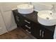 Contemporary bathroom vanity with dual vessel sinks, sleek chrome faucets, and dark cabinets at 162 Autumn Falls Dr, Lake Wylie, SC 29710