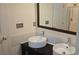 Stylish bathroom featuring dual vessel sinks, modern faucets, and a framed mirror at 162 Autumn Falls Dr, Lake Wylie, SC 29710