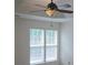A serene bedroom featuring a ceiling fan and bright windows that let in natural light at 162 Autumn Falls Dr, Lake Wylie, SC 29710