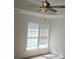 Bedroom featuring neutral walls, tray ceiling with fan, and two large windows at 162 Autumn Falls Dr, Lake Wylie, SC 29710