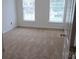 A cozy bedroom features neutral carpet and bright windows, creating a serene and inviting space at 162 Autumn Falls Dr, Lake Wylie, SC 29710