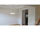 Bright dining area with chandelier and view into kitchen with stainless appliances at 162 Autumn Falls Dr, Lake Wylie, SC 29710