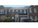 Charming brick townhome featuring a one-car garage and well-maintained landscaping at 162 Autumn Falls Dr, Lake Wylie, SC 29710