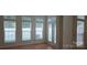 Sun-filled living room featuring many large windows and a door to the exterior at 162 Autumn Falls Dr, Lake Wylie, SC 29710