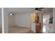 Inviting living room featuring plush carpet, ceiling fans, and an open layout into the kitchen area at 162 Autumn Falls Dr, Lake Wylie, SC 29710