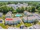 Aerial view of the community with multiple buildings, parking, and an inviting community pool at 17406 Tuscany Ln, Cornelius, NC 28031