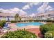 Inviting community pool surrounded by lounge chairs and well-manicured landscaping at 17406 Tuscany Ln, Cornelius, NC 28031