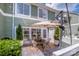 Relaxing patio space with comfortable seating, mature potted plants, and string lights at 17406 Tuscany Ln, Cornelius, NC 28031
