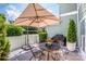 Outdoor patio featuring an outdoor table with a large umbrella at 17406 Tuscany Ln, Cornelius, NC 28031