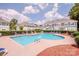 Community pool surrounded by manicured grounds and complemented by stylish chaise lounges at 17406 Tuscany Ln, Cornelius, NC 28031