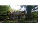 Charming home with a porch, surrounded by mature trees and a carport at 202 N Dilling St, Kings Mountain, NC 28086