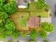Aerial view of a home with a large backyard, patio, lush landscaping, and a nearby playground at 2103 Cantata Ct, Matthews, NC 28105