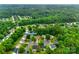 An aerial view pinpoints the location of 2103 Cantata Ct in a neighborhood filled with lush, green trees at 2103 Cantata Ct, Matthews, NC 28105