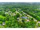 An aerial view showcases the lush greenery surrounding the neighborhood of 2103 Cantata Ct home at 2103 Cantata Ct, Matthews, NC 28105