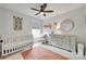 Bright Bedroom featuring a crib, dresser, and charming decor for a cozy and inviting space at 2103 Cantata Ct, Matthews, NC 28105