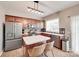 Modern kitchen with stainless steel appliances, an island, and plenty of cabinet space at 2103 Cantata Ct, Matthews, NC 28105