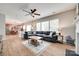 Open-concept living area with a large sectional sofa and connecting view to the kitchen at 2103 Cantata Ct, Matthews, NC 28105