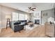 Cozy living room with a fireplace, large windows and a comfortable gray sectional sofa at 2103 Cantata Ct, Matthews, NC 28105