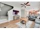 Living room with TV, fireplace, stairs, and view to the kitchen at 2103 Cantata Ct, Matthews, NC 28105
