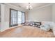 Spacious living room with hardwood floors, natural light, and comfortable seating at 2103 Cantata Ct, Matthews, NC 28105