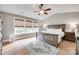 Spacious main bedroom with abundant natural light, hardwood floors, and a comfortable sleeping area at 2103 Cantata Ct, Matthews, NC 28105