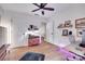 Stylish home office featuring hardwood floors, ample shelving, and a comfortable workspace at 2103 Cantata Ct, Matthews, NC 28105