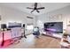 Well-lit office space with hardwood floors, a large monitor, and a comfortable sitting area at 2103 Cantata Ct, Matthews, NC 28105